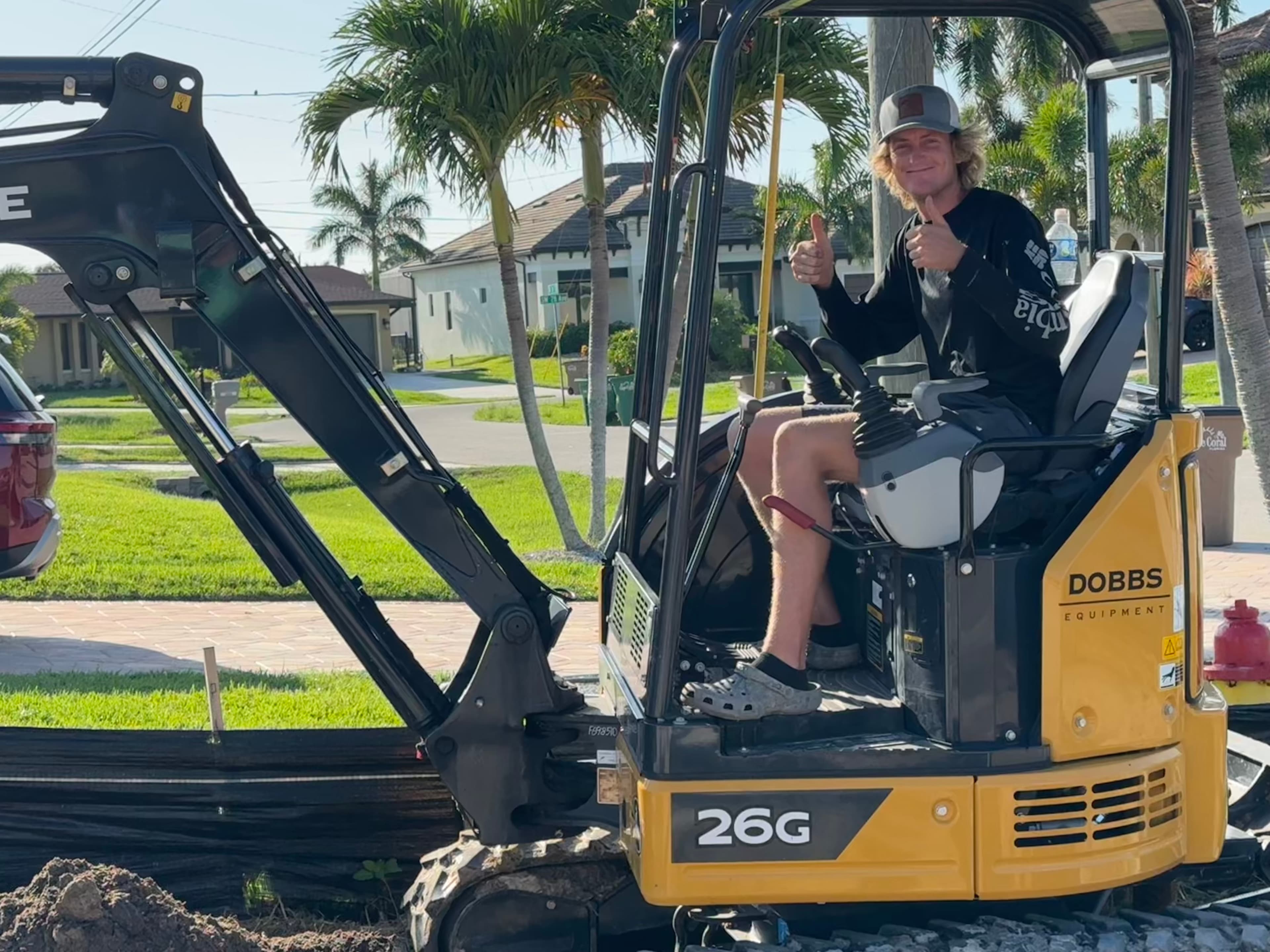 Team at work with mini excavator